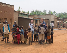 Chris and Davide surrounded by kids living in the village of Kagano, Eastern province of Rwnada (Photo taken by Phillip Wood).