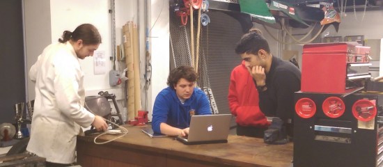 Oisin and some of the team preparing to strip down the car in the pit garage at Imperial College London