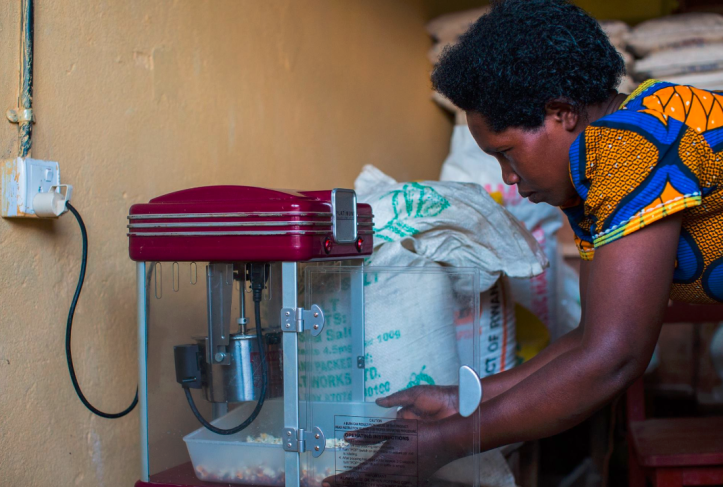 Example of productive use of energy facilitated by MeshPower and E4I, a popcorn making machine that increases the income from the shop. Photo from Meshpower