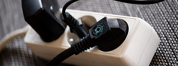 A selection of plugs in power sockets